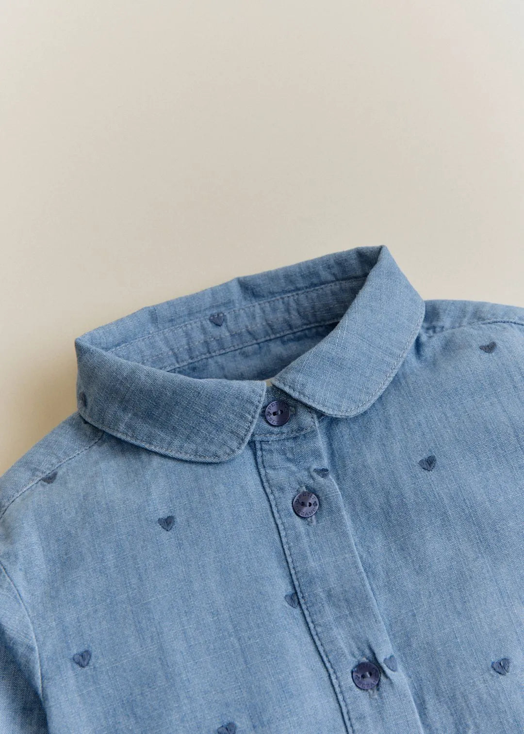 Chambray with embroidered navy hearts