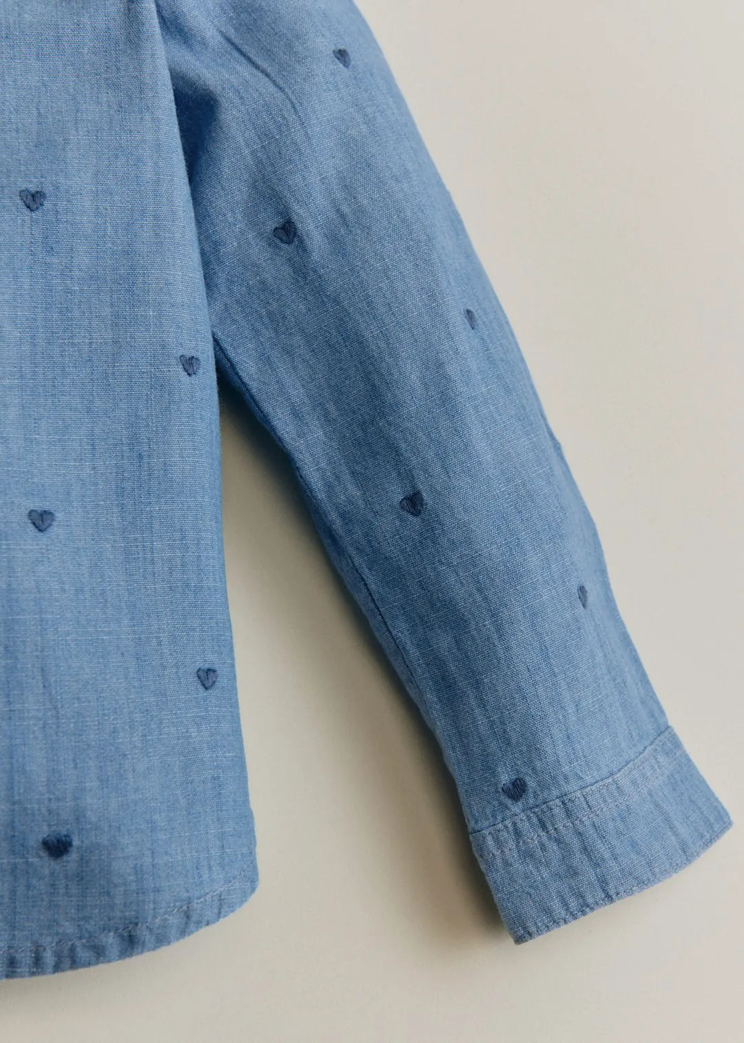 Chambray with embroidered navy hearts